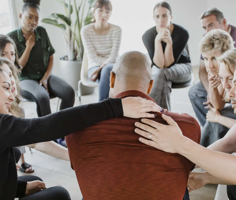 people in drug recovery helping each other